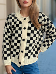 Checkerboard knit button-up cardigan in black and taupe with cream trim and black buttons.