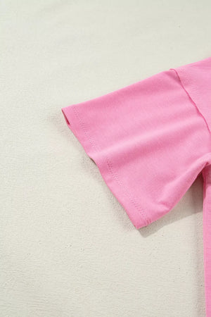 Pink cotton tunic t-shirt with short sleeves and a relaxed fit.
