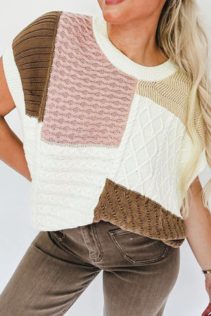 Patchwork cable knit tank top in dusty pink, white, brown, and beige with a crew neck and sleeveless design.