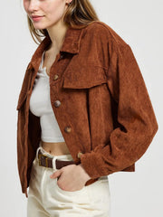Brown corduroy utility jacket with buttoned patch pockets and collar.
