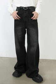 Oversized black wash denim jeans with a wide leg and casual styling.