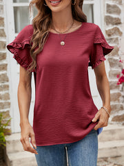Burgundy t-shirt with textured fabric and ruffled short sleeves.