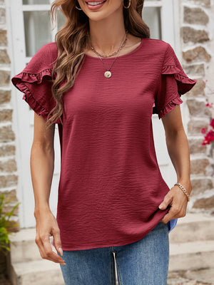 Burgundy t-shirt with textured fabric and ruffled short sleeves.
