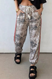 Camo print maternity pants with drawstring and side stripes, relaxed fit.