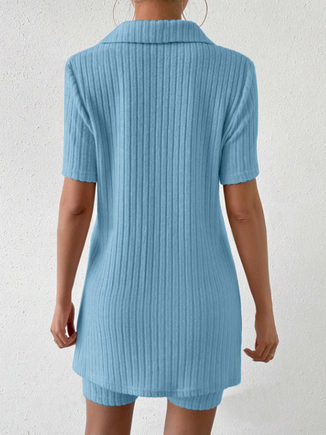 Light blue ribbed polo shirt and shorts co-ord set with short sleeves and collar.