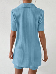 Light blue ribbed polo shirt and shorts co-ord set with short sleeves and collar.