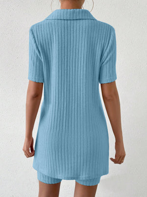 Light blue ribbed polo shirt and shorts co-ord set with short sleeves and collar.