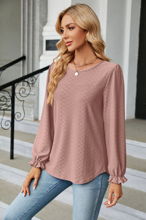 Dusty Pink textured puff sleeve blouse with ruffle cuffs and crew neck.