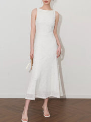 White midi dress with floral applique, boat neck, and a-line cut.