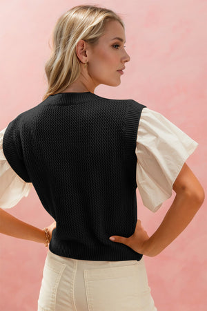 Black knit vest with ruffled poplin sleeves