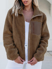 Brown sherpa zip-up jacket with a zip chest pocket and contrast trim.