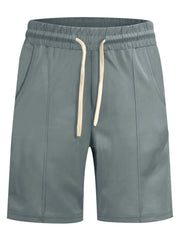 Men's sage chino shorts with drawstring waist and side pockets.