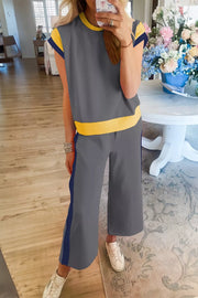 Contrast trim two-piece set with grey top and pants, yellow trim, and blue side stripe detail.