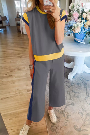 Contrast trim two-piece set with grey top and pants, yellow trim, and blue side stripe detail.
