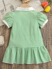 Baby gum leaf gingham polo dress with white collar, cuffs, and ruffle hem.
