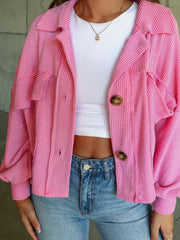 Textured boxy utility shirt jacket in Fuchsia Pink with button front and chest pockets.