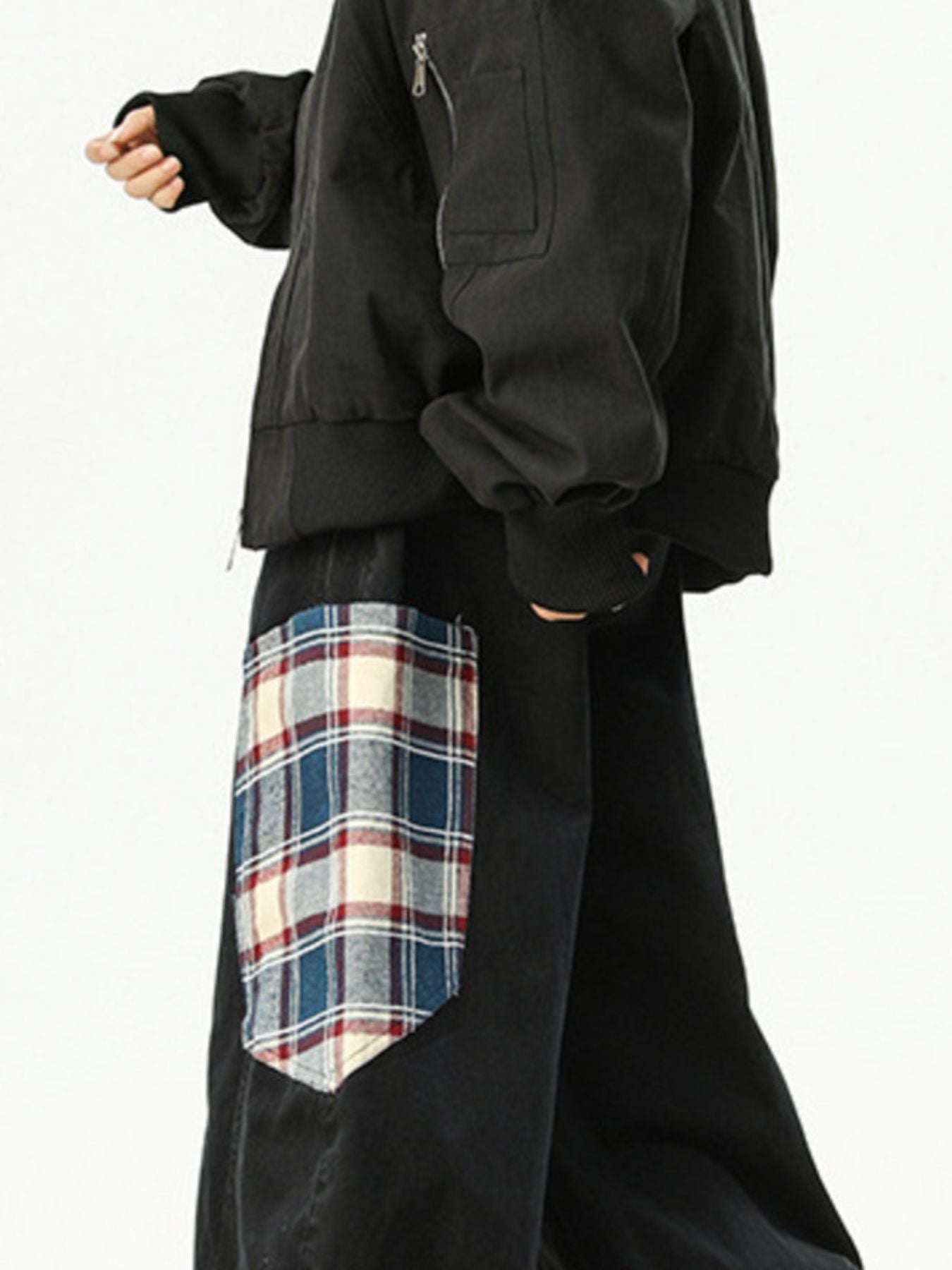 Men's black wide leg sweatpants with a plaid pocket detail.