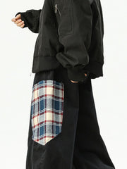 Men's black wide leg sweatpants with a plaid pocket detail.