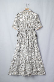 Print button-down midi dress with drawstring waist and tiered skirt.