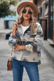 Southwestern print overshirt jacket in tan with blue and brown geometric pattern, button front, and chest pockets.