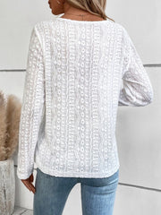 White textured long sleeve henley top with open knit pattern.