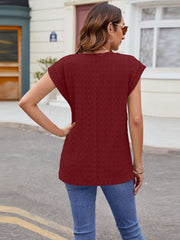 Textured cap-sleeve tee in wine with subtle knit fabric and a relaxed fit.