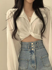 White polyester long sleeve shirt with knot front detail and buttoned collar