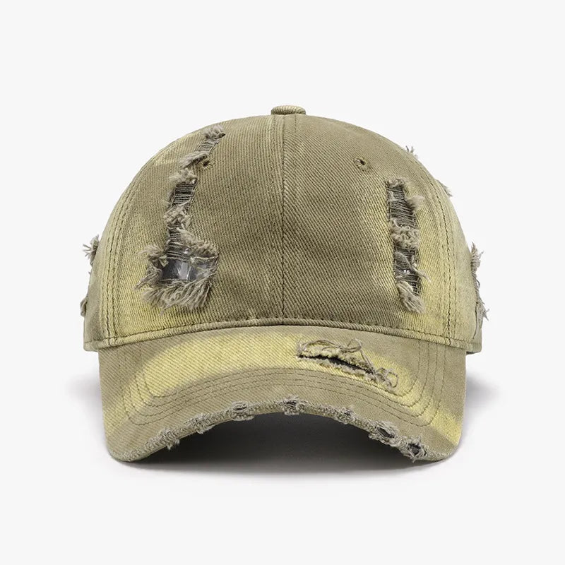 Shredded canvas baseball cap in yellow-green with distressed details and frayed edges.
