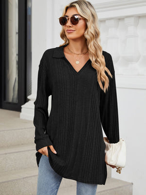 Black ribbed knit collared tunic top with slit hem and long sleeves.