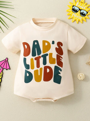 Baby bodysuit in beige with colorful "Dad's Little Dude" graphic print, short sleeves