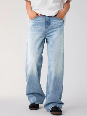Men's light wash wide-leg jeans with a relaxed fit and faded details.