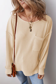 Ribbed knit tan long sleeve top with a patch pocket and crew neck.