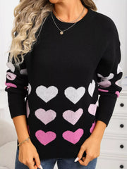 Black crew neck sweater with pink and white hearts pattern, acrylic knit