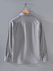 Light gray cotton overshirt with buttoned cuffs and collar.