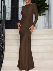 Brown ruched long sleeve maxi dress with knot detail and boat neckline.