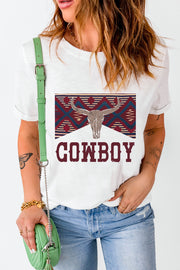 White graphic t-shirt with bull skull and cowboy text, featuring a geometric pattern.