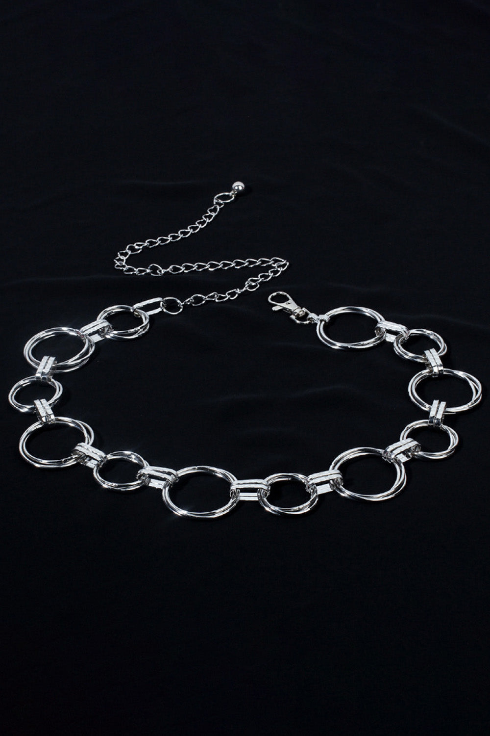 Silver linked circle waist chain belt with adjustable clasp and extender.
