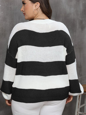 Wide stripe relaxed knit jumper in black and white acrylic with a crew neck and long sleeves.