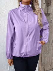 Lavender nylon bomber jacket with drawstring hem and zip front.