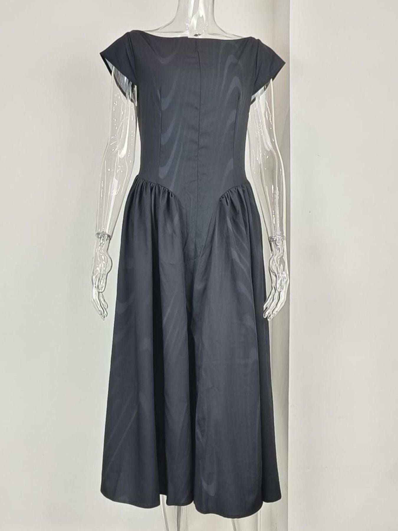 Black cap sleeve A-line midi dress with boat neck and subtle striped pattern.