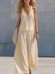 Yellow striped two-piece set with ruffle trim V-neck tank and wide-leg pants.