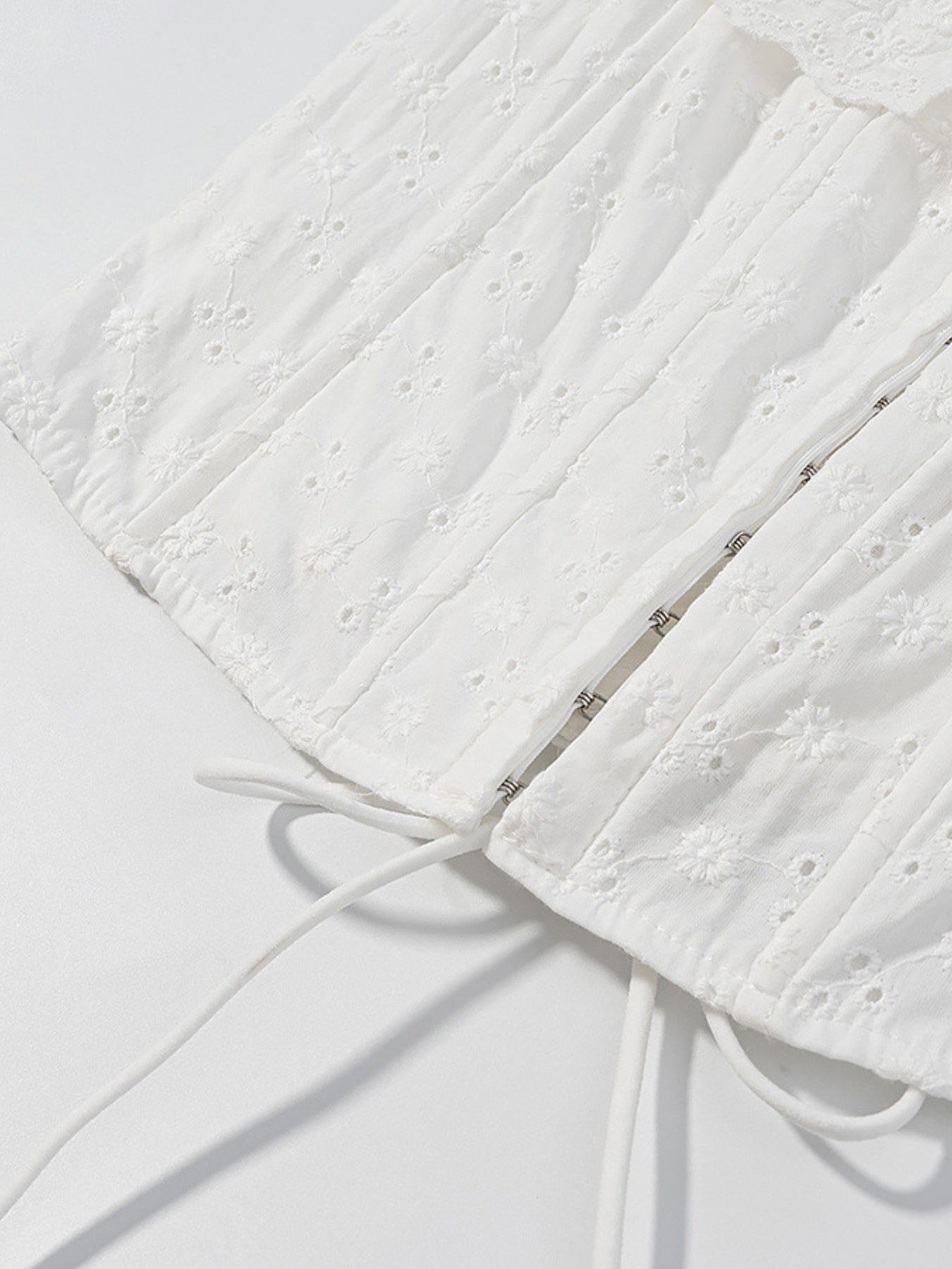 White eyelet tank top with corset detail and drawstring ties