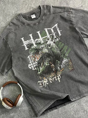 Acid wash graphic tee in dark gray with "The Drip" text and distressed artwork.