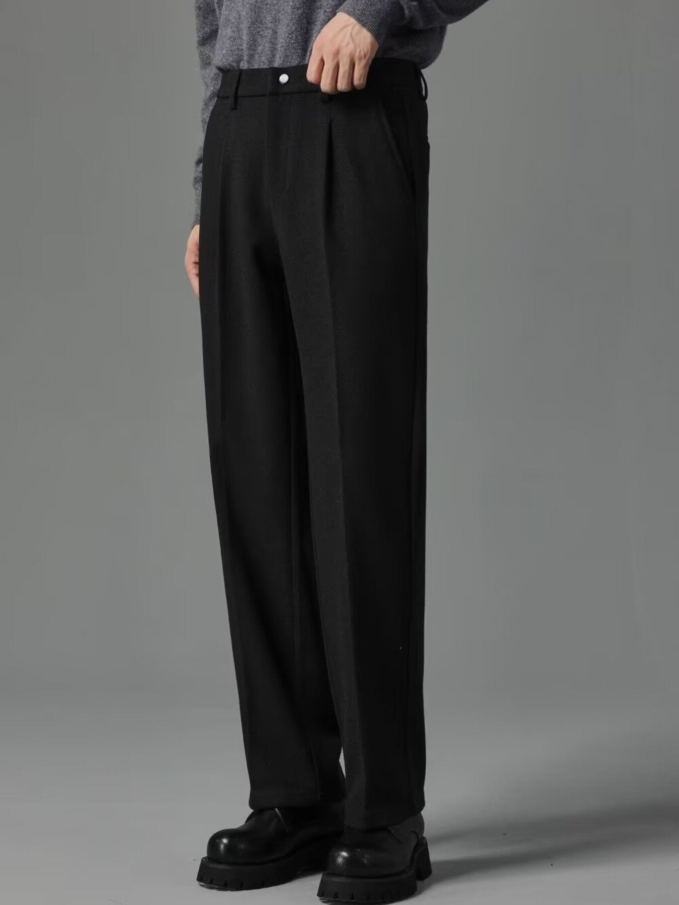 Men's black premium pocketed sweatpants with a relaxed fit.