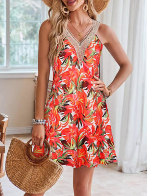 A-line dress with tropical print, crochet neckline, and red-blue color.