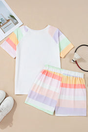 White loungewear set with pastel rainbow stripes on the sleeves and shorts.