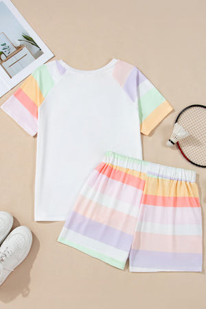 White loungewear set with pastel rainbow stripes on the sleeves and shorts.