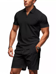 Black textured polo shirt and shorts ensemble for men, casual activewear set.
