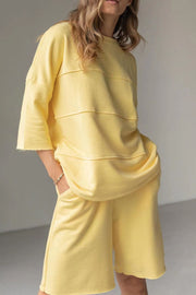 Relaxed fit Banana Yellow sweatshirt with seam details and matching shorts.