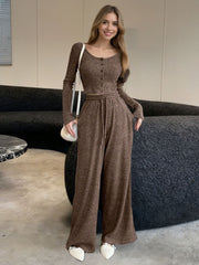 Brown ribbed knit two-piece set with button-down crop top and drawstring wide-leg pants.